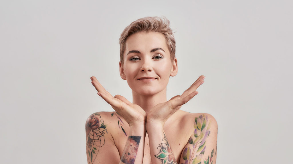Woman with tattoos and short hair